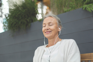 older woman listening to music