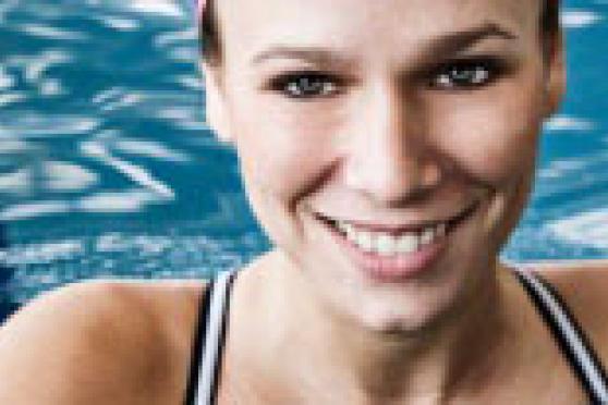 Photo: Smiling woman in swimming pool