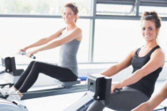 Photo: 3 women on rowing machines in a gym