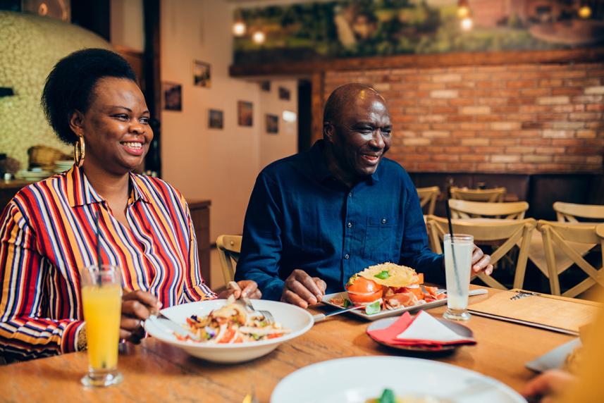 A couple enjoys a meal at a restaurant