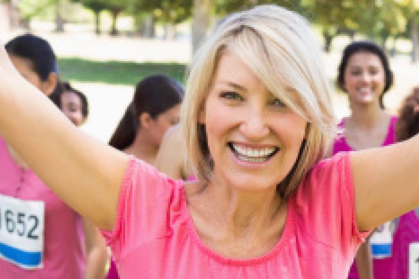 Photo: Happy women in pink t-shirts at running race