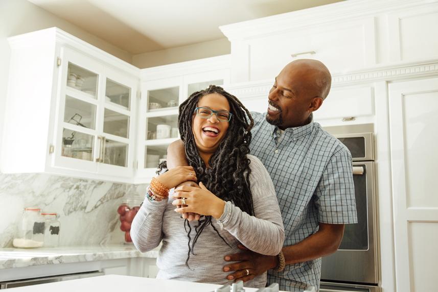 Man and woman hugging in the kitchen