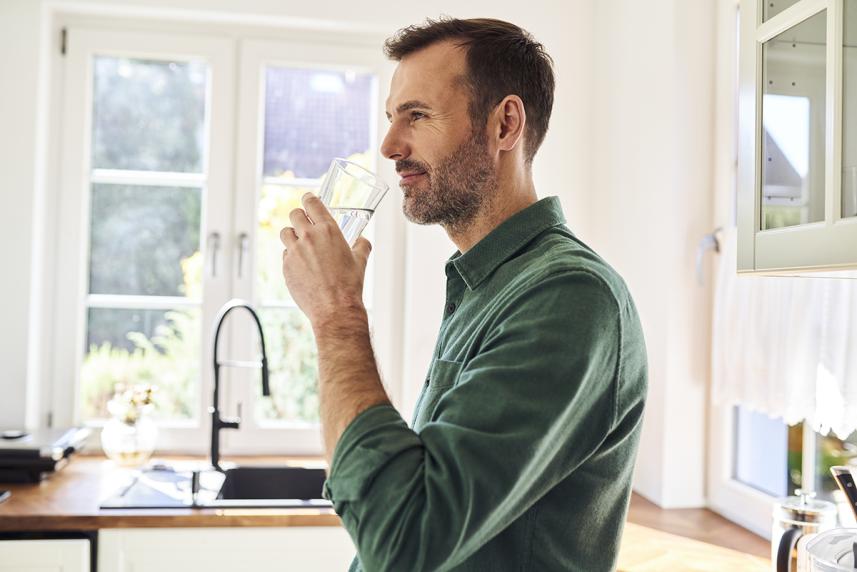 Man drinking a glass of water