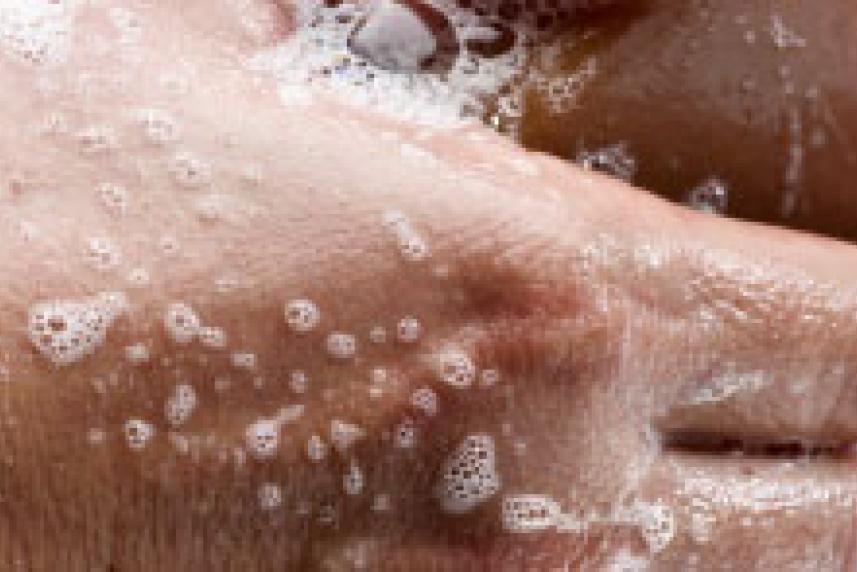 Photo: Close-up of washing hands with bar of soap