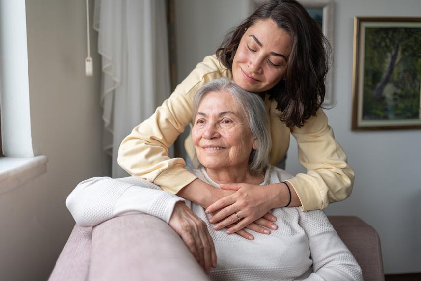 Mother and daughter hugging