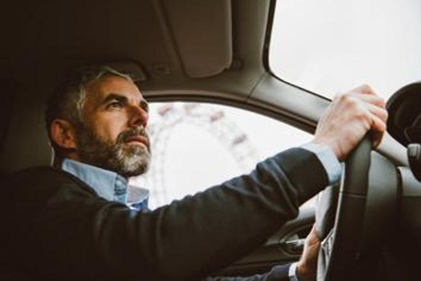 Photo: Man driving his car