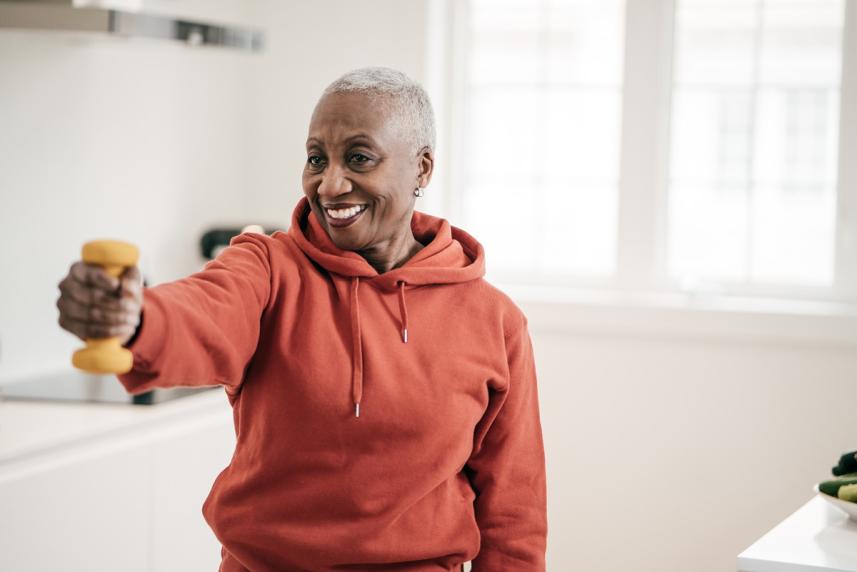 Older woman exercising with dumbbells