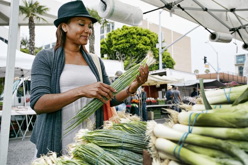 Woman shopping for groceries at an outdoor market