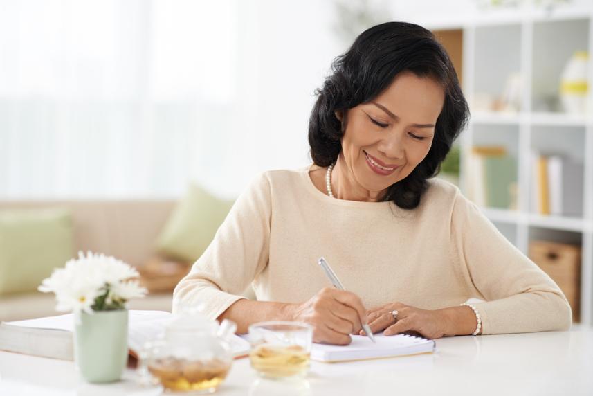 Woman writing down some notes