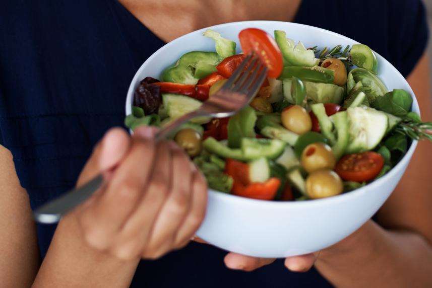 woman eating salad