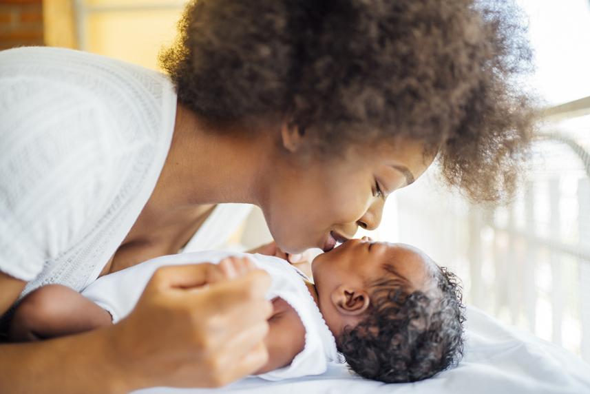 Mother kissing infant