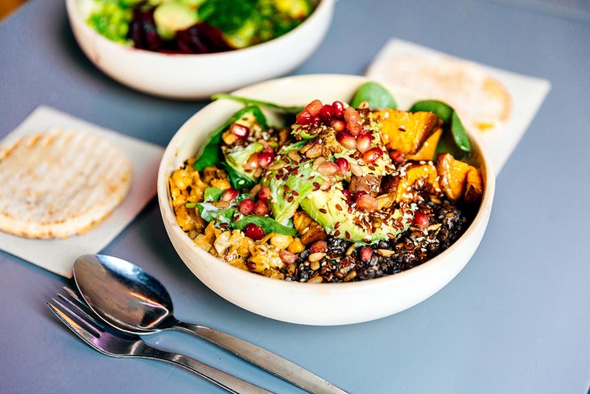 Bowl of salad on blue table