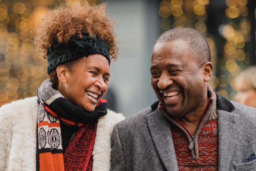 Couple walking outside laughing