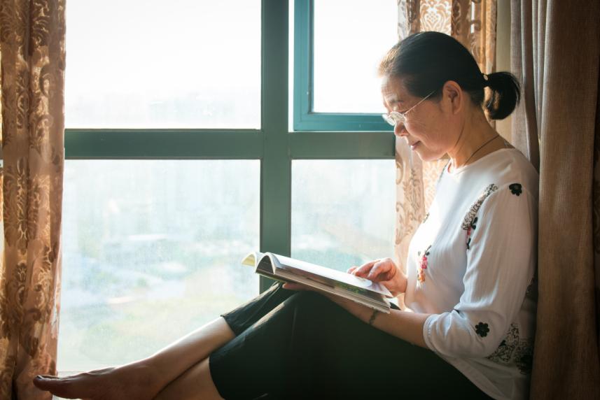 Reading by a window