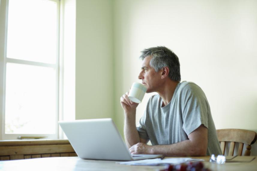 Older man looking out the window 