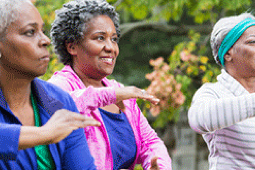 Photo: Three older woman doing yoga in the park