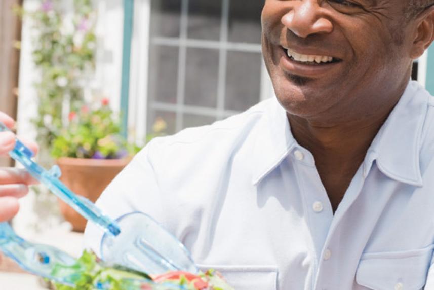 Photo: Man being served salad