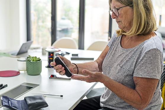 Woman checking her blood sugar.