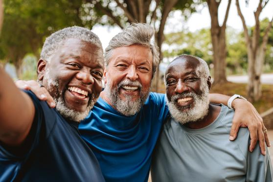 Group of senior, male friends smiling