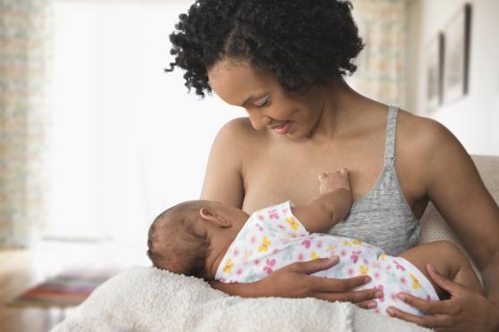 Mother breastfeeding her infant
