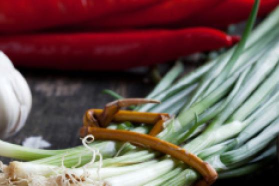 Photo: Fresh cloves of garlic and bundle of chives