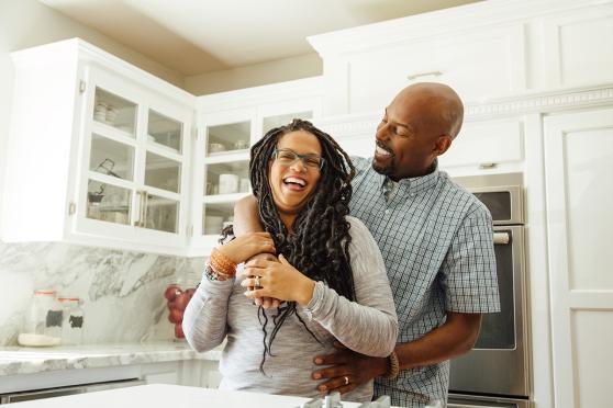 Man and woman hugging in the kitchen