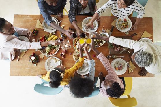 Family sitting around the table, eating a holiday meal