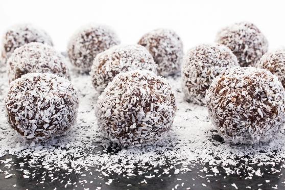 Chocolate balls covered with coconut flakes