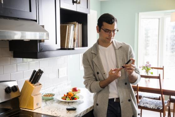 man checking glucose levels