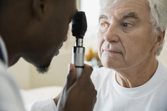 Older man getting his eyes checked.