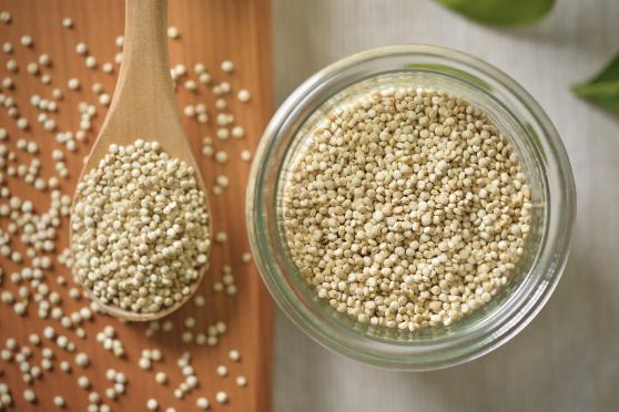 Quinoa on a spoon, quinoa in a bowl