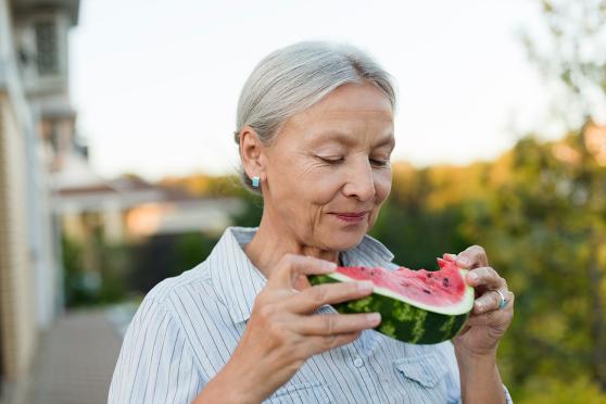 Woman eating watermelon.