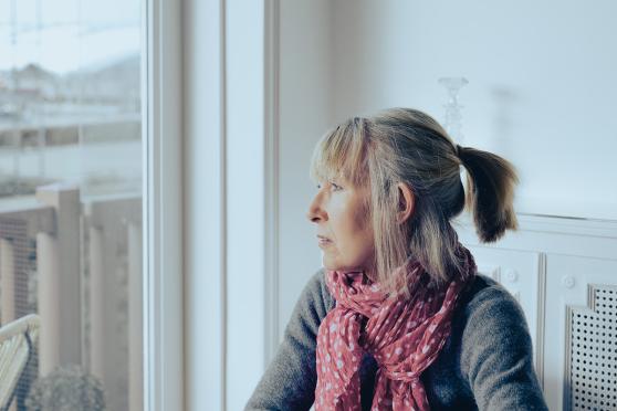 Woman looking out a window