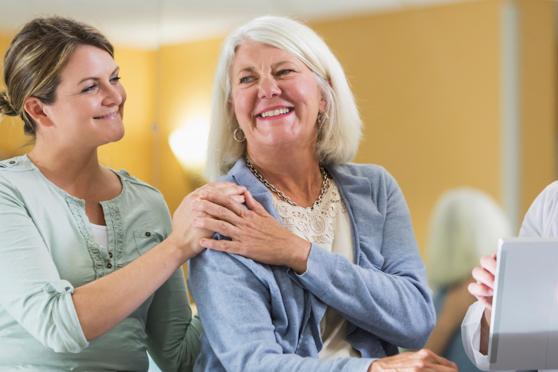 older woman with young adult daughter at the doctors