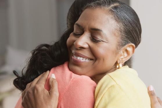 Photo: Woman receiving a hug.